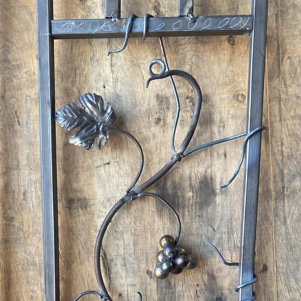 First of 3 panels almost done and held up with a mousehole forge bench vice. (3)